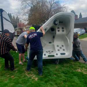 Hot tub removal service. Crew removing hot tub.